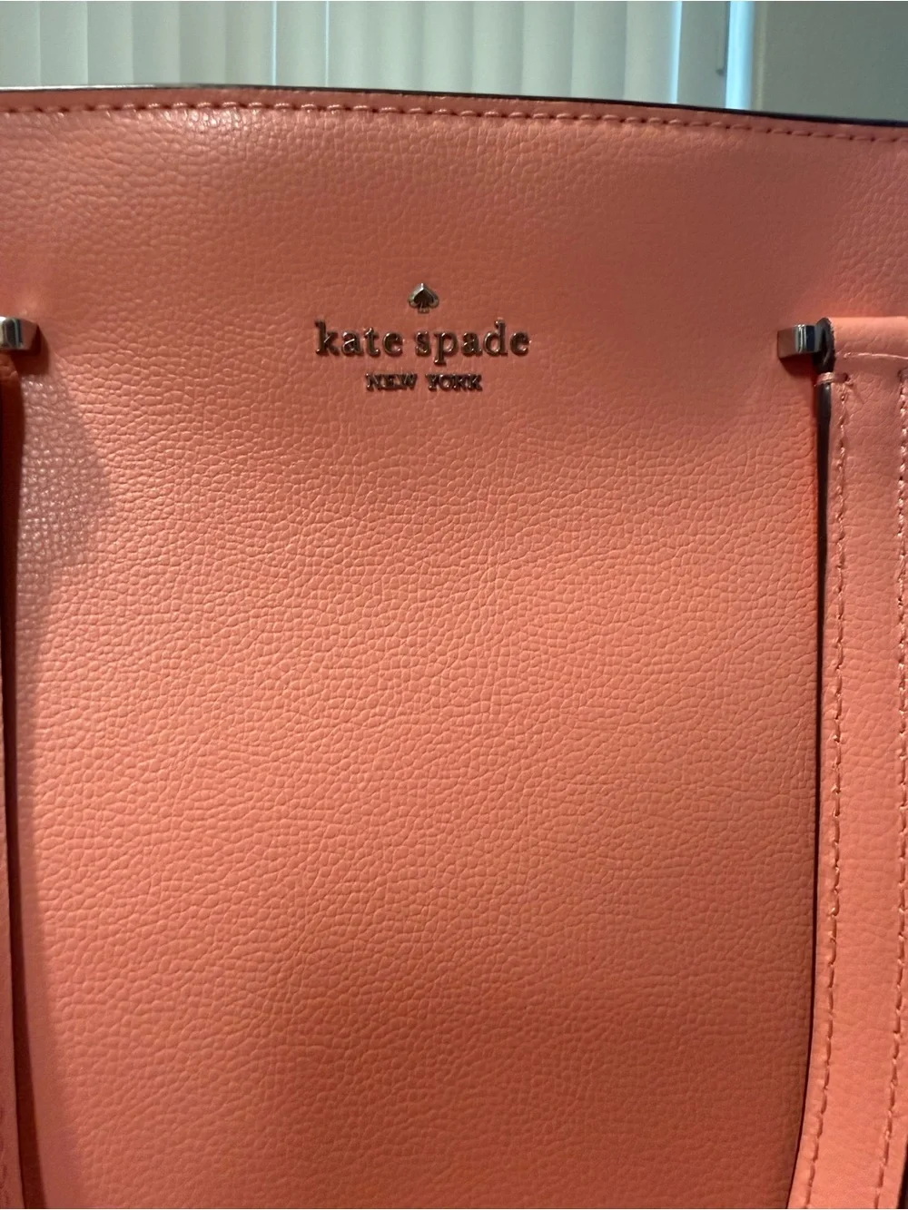 Kate Spade shoulder bag with crossbody strap.